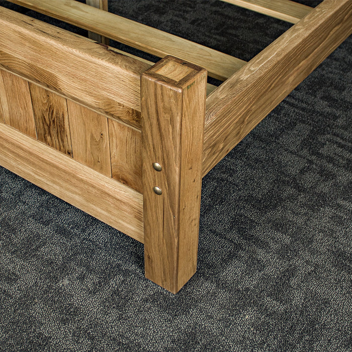 A closer view of the strong bolts that connect the side rails to the footboard of the Amalfi Super King Oak Bed Frame.