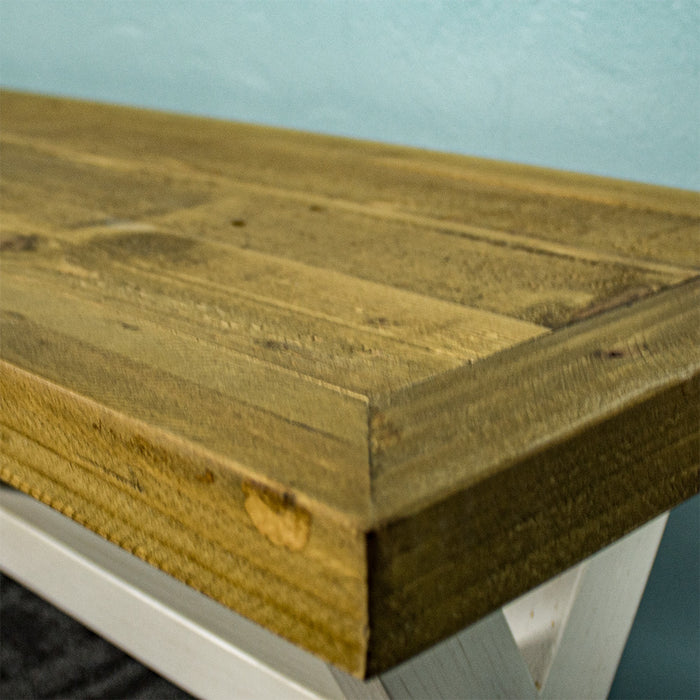 Close up of the rimu-stained top of the Byron Recycled Pine Bench