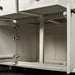 A view of behind the doors on the Loire Two-Tone Medium Oak Buffet.