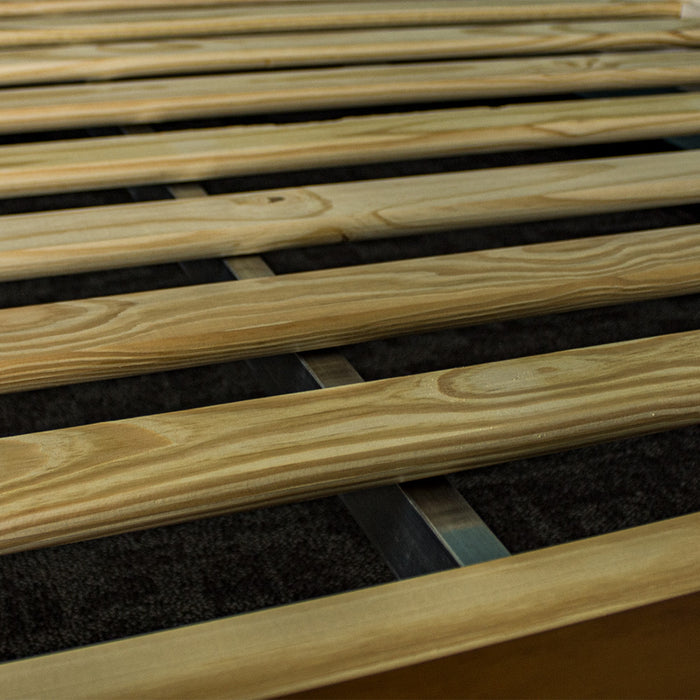 A closer view of the metal support bar underneath the slats of the Alton Queen Size Pine Slat Bed Frame