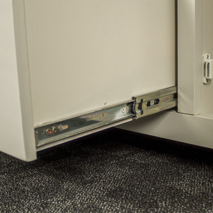 Close up of the metal runners on the white Alton 2 Door 5 Drawer Buffet