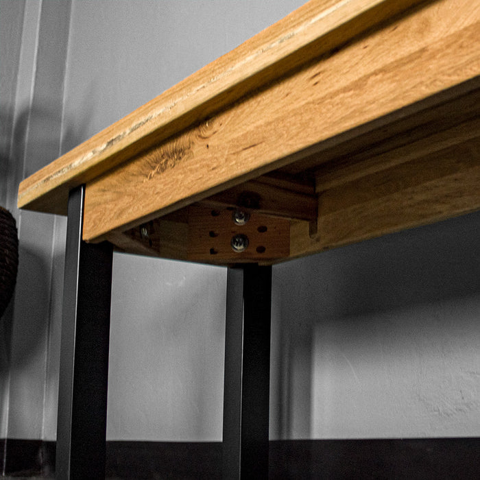 A view of the bolts that securely hold the legs to the body of the Golden Gate Oak Bench Seat