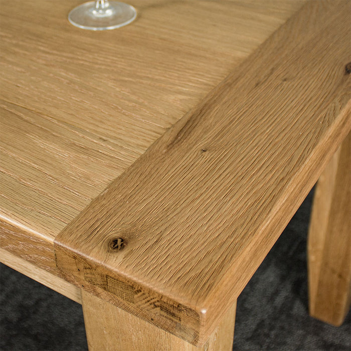 A close up of the top of the Amstel Square Oak Coffee Table, showing the wood grain.