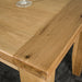 A close up of the top of the Amstel Square Oak Coffee Table, showing the wood grain.