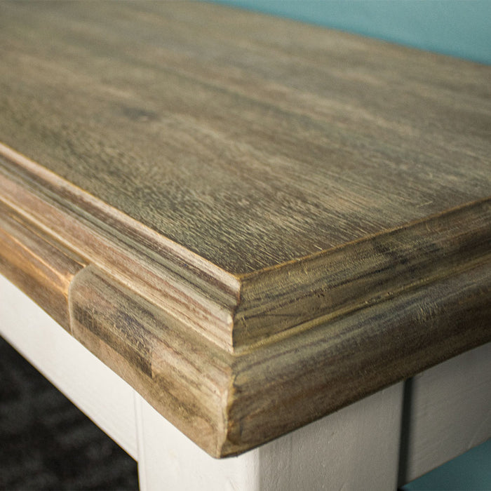 A close up of the top of the Biarritz 1.4m Bench, showing the wood grain and colours.