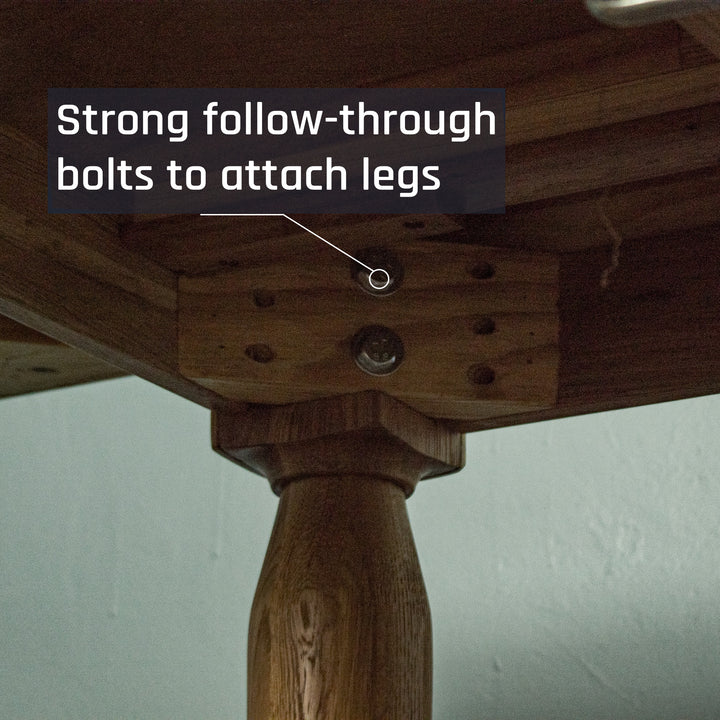A view of the bolts that hold the legs to the Boston Oak Extending Dining Table - Natural Oak.