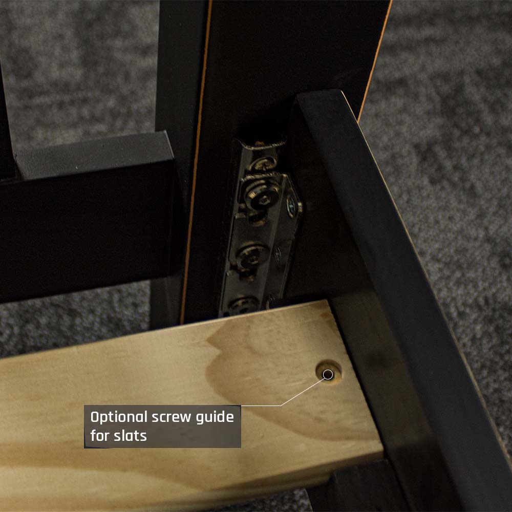 A close up of the slat screw guides and bolts that connect the bed frame together.