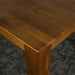 A close up of the top of the Hamilton Dining Table with Rimu Finish (1.8m)