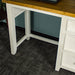 A view of under the Tuscan Recycled Pine Small Desk, with support braces.