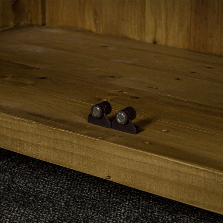 Close up of the magnet that holds the door shut for the cupboard of the Ventura Recycled Pine Buffet