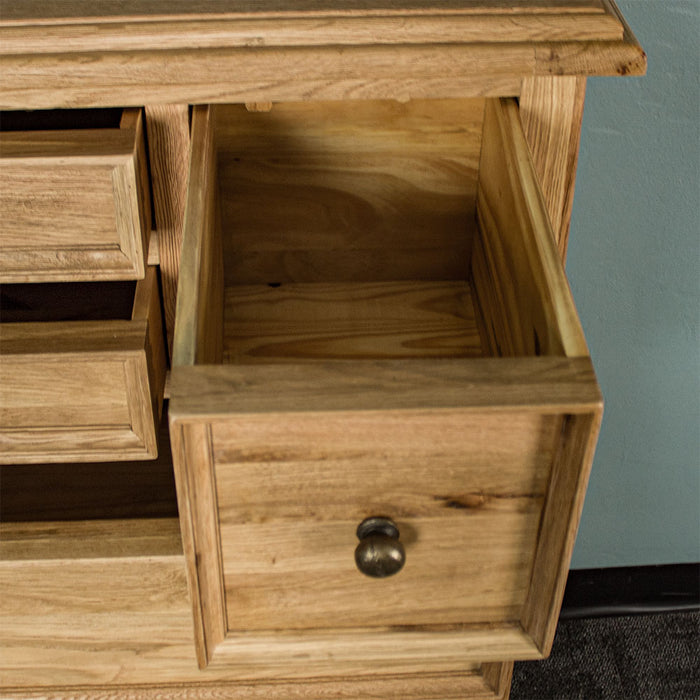 An overall view of the smaller top drawer on the Versailles Oak 7 Drawer Chest.