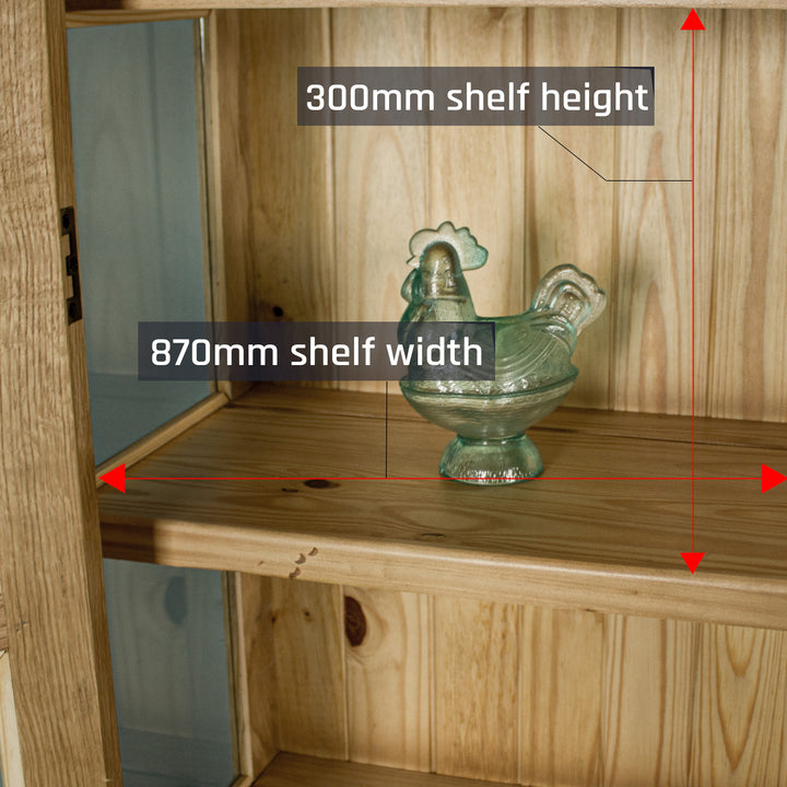 A view of the shelf on the Vienna Oak Glass DIsplay Cabinet. There is a blue glass ornament in the shape of a chicken on display.