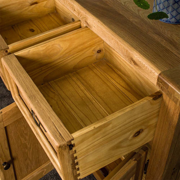An overall view of the drawer on the Yes 3 Door 3 Drawer Oak Buffet.