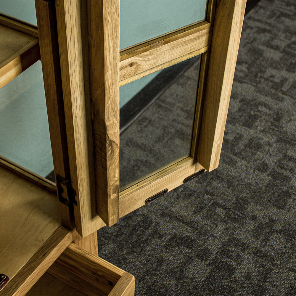 A view of the inside of the door on the Yes 2 Door 4 Drawer Glass Display Cabinet.