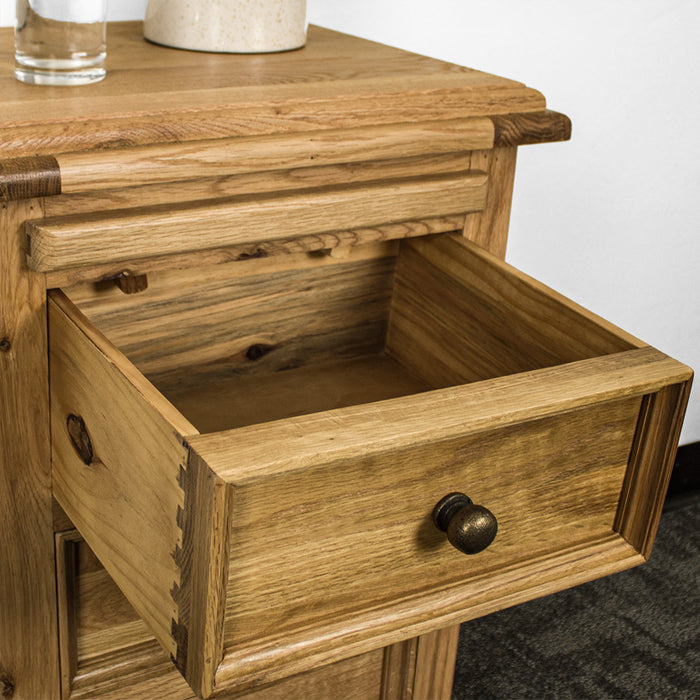 An overall view of the top drawer on the Versailles Oak Bedside Cabinet.