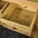 An overall view of the drawer on the Maximus Small Oak Buffet