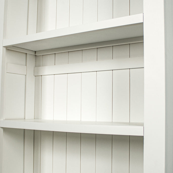 A closer view of the shelf of the Felixstowe Large Pine Bookcase.