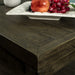 Top view of the Stonemill Recycled Pine Coffee Table, which shows off the wood grain and brown colour. There is also a fruit platter seen in the top.