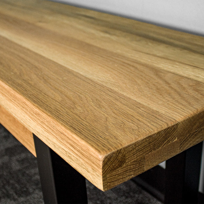 A close up of the top of the Golden Gate Oak Bench Seat, showing the wood grain and colour.