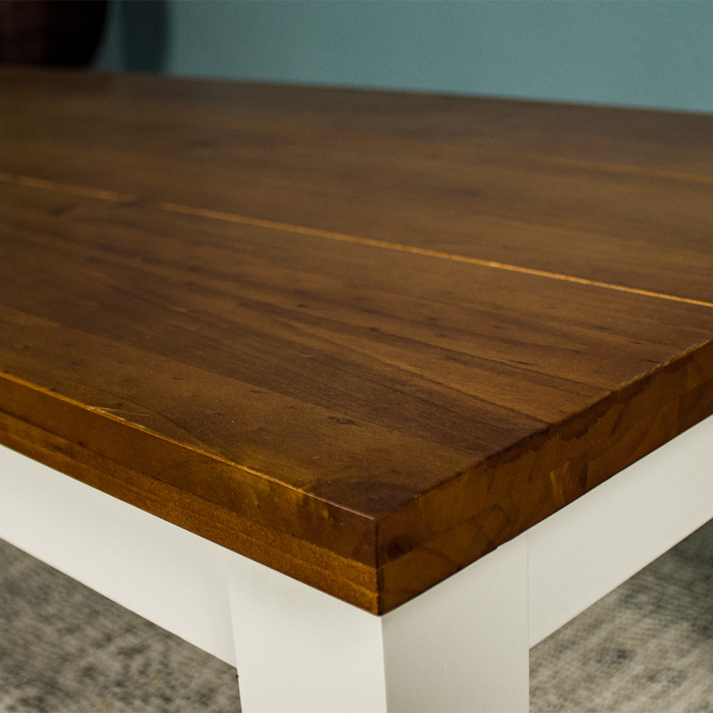 A close up of the top of the Alton Mid Size Coffee Table, showing the rimu stain and wood grain.