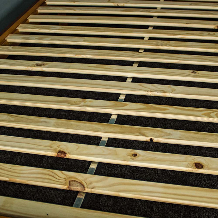 A view of the metal bar that supports the slats on the Alton Rimu-Stained NZ Pine King Bed Frame.