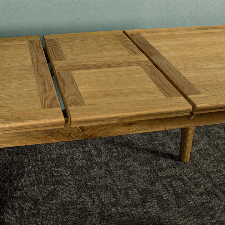 A view of the process to extend/shorten the Boston Oak Extending Dining Table - Natural Oak.