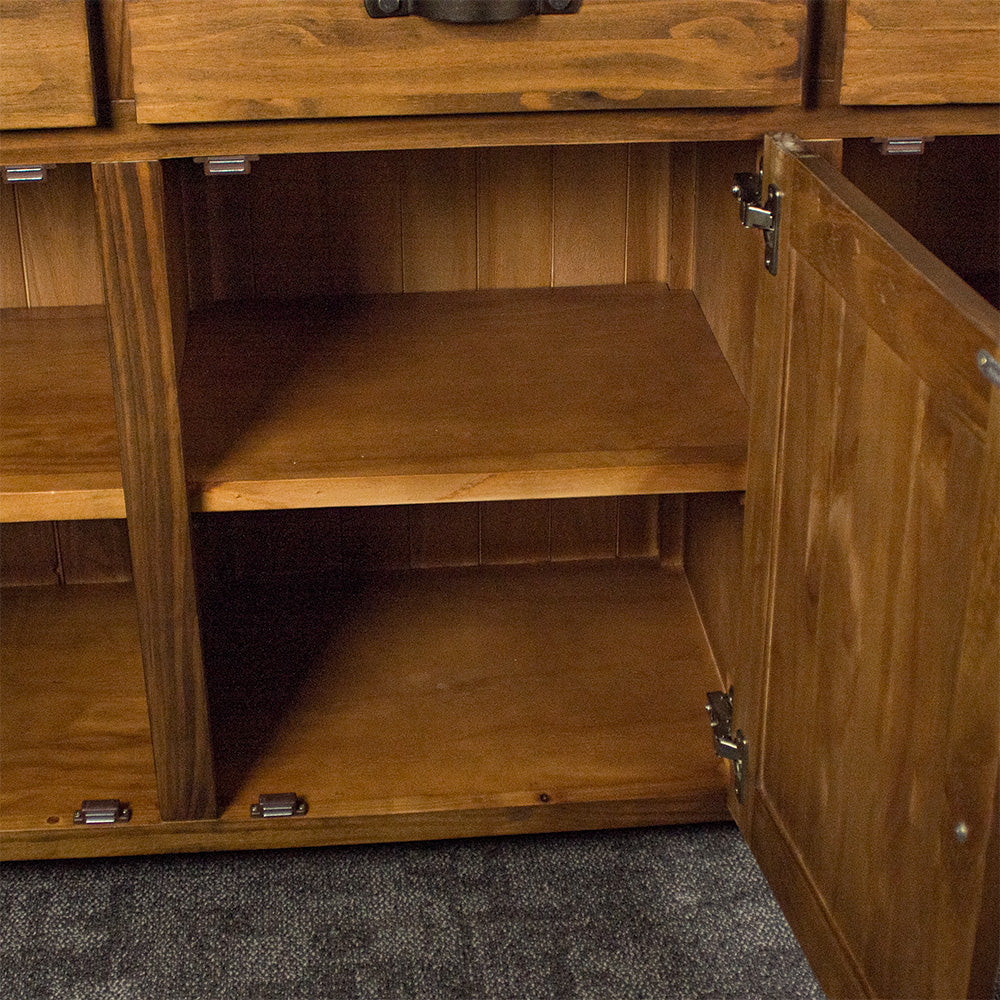 An overall view of the shelving in the Botanica 3-Drawer Large Buffet.
