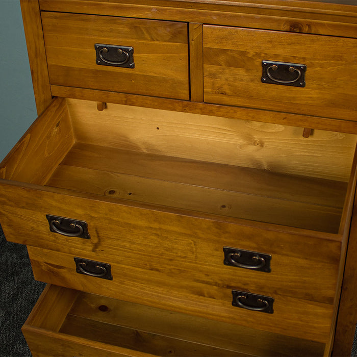 An overall view of the larger lower drawers on the Montreal Five Drawer Pine Tallboy.