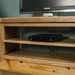 An overall view of the shelving on the Vancouver Value Oak Entertainment Unit.