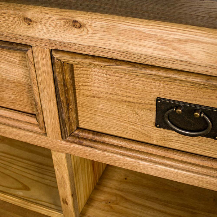 A close up of the trim of the drawers on the Yes 3 Door 3 Drawer Oak Buffet.