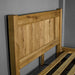 A closer view of the headboard on the Amalfi Oak Queen Bed Frame.