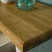 A close up of the top of the Loire Oak Hall Table, showing the wood grain and colour.