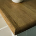 A close up of the top of the Loire Oak Console Table, showing the wood grain and colour.