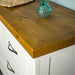 A close up of the top of the Felixstowe 7 Drawer Pine Lowboy showing the wood grain and colour.