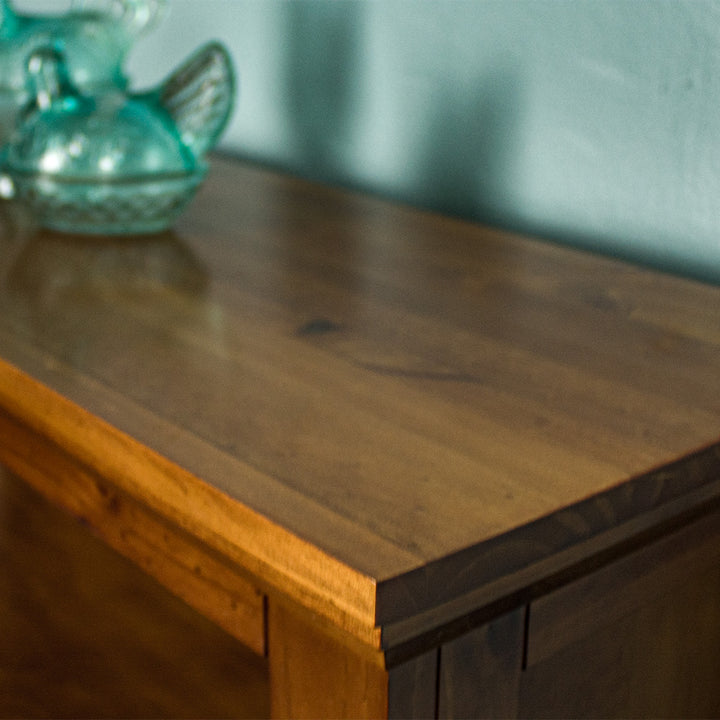 A close up of the top of the Montreal Short Pine Bookcase, showing the wood grain and colour.