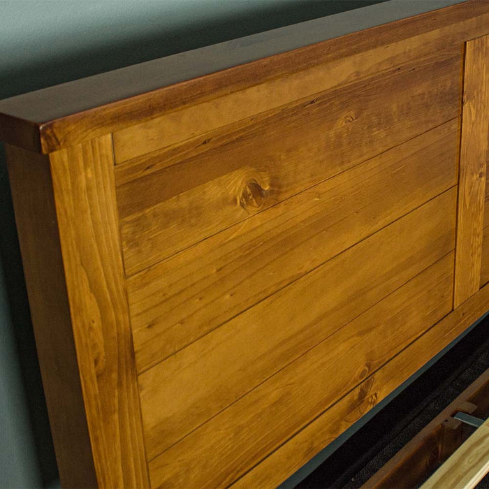 The side of the headboard on the Alton Rimu-stained NZ Pine Queen Bed Frame.