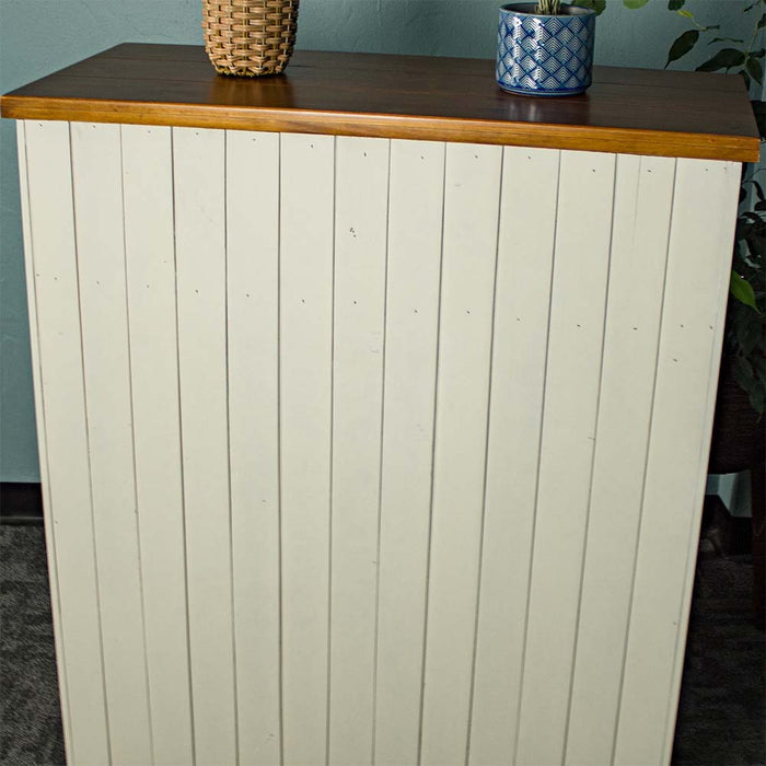 An overall view of the back of the Alton 6 Drawer NZ Pine Tallboy, which features tongue and groove panelling.