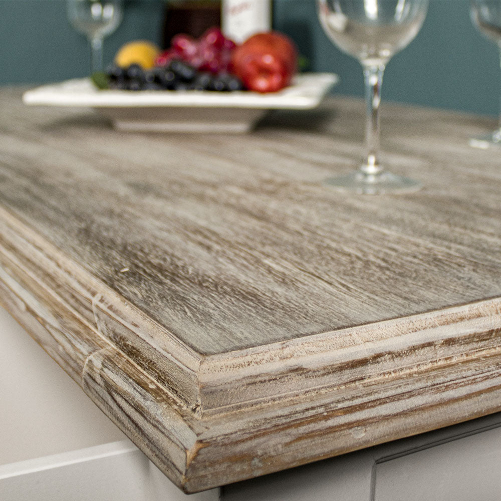 A close up of the top of the Biarritz 4 Drawer Extra-Large Coffee Table, showing the wood grain, colours and frosted white top.