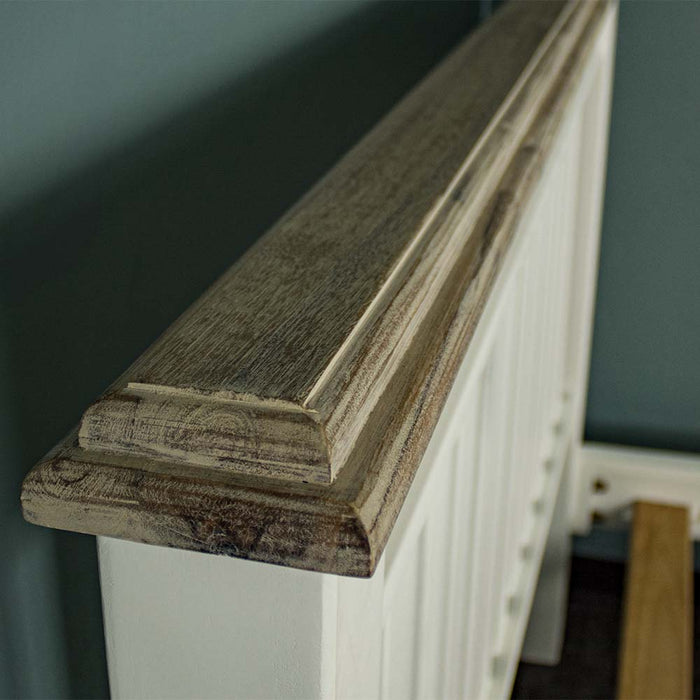 A close up of the top of the Biarritz Two-Tone Queen Size Slat Bed Frame, showing the wood grain and colour.