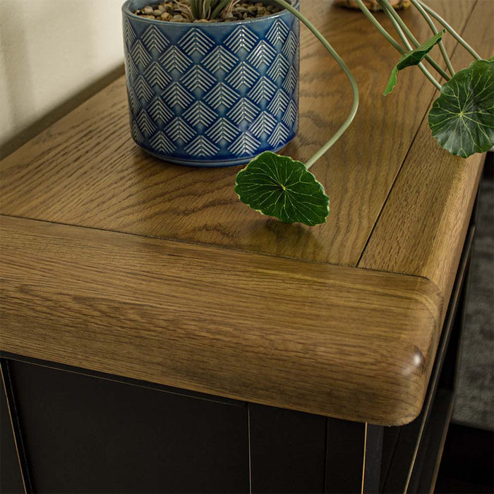 A close up of the top of the Cascais Oak Low Bookcase, showing the wood grain and colour.