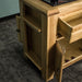 The other side of the Danube Compact Granite Top Oak Kitchen Island, which is mirrored.