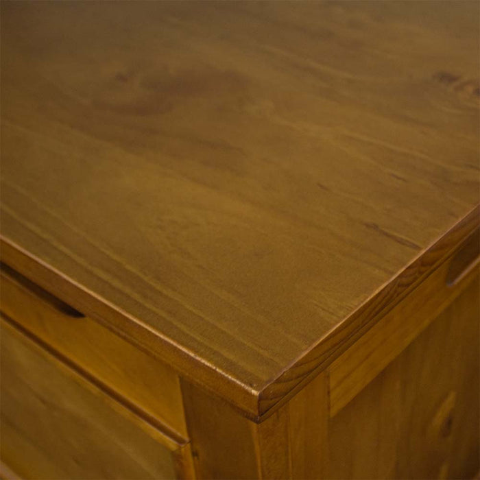 A close up of the top of the Montreal Pine Blanket Box, showing the wood grain and rimu stain.