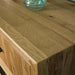 A close up of the top of the Ormond 8 Drawer Oak Tallboy, showing the wood grain.