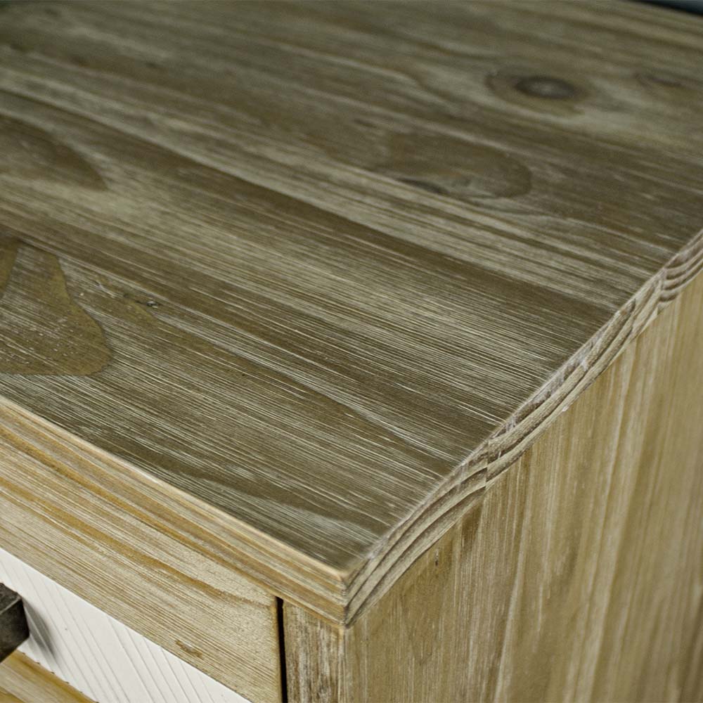 A close up of the top of the Soho 5 Drawer Tallboy, showing the wood grain and colour.