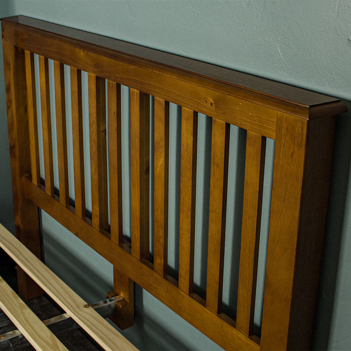 The headboard of the Trent Double Size NZ Pine Slat Bed Frame.