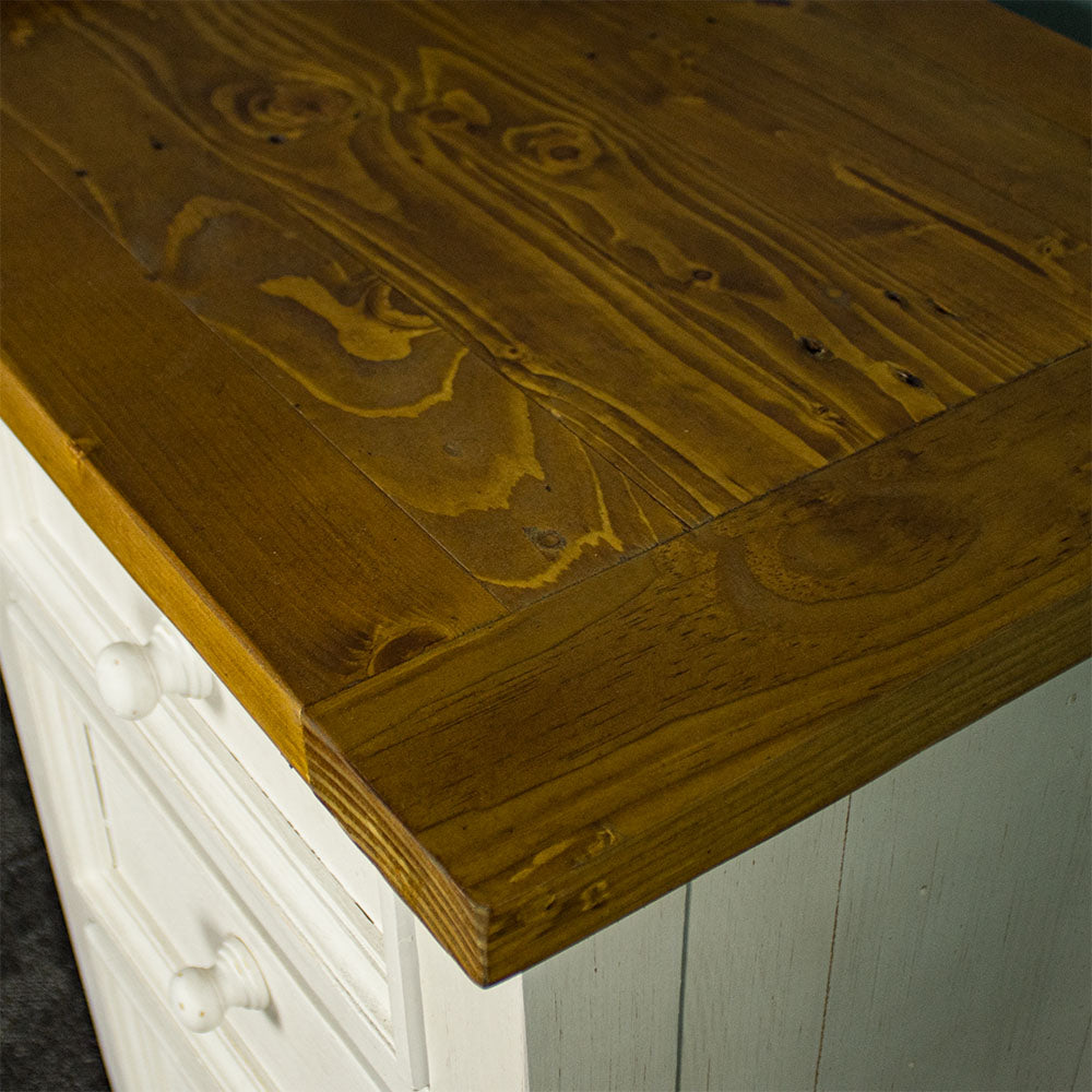A close up of the top of the Tuscan Recycled Pine Small Desk, showing the colour and wood grain.