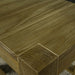 A close up of the top of the Vancouver Pine Nesting Tables, showing the wood grain and colour.