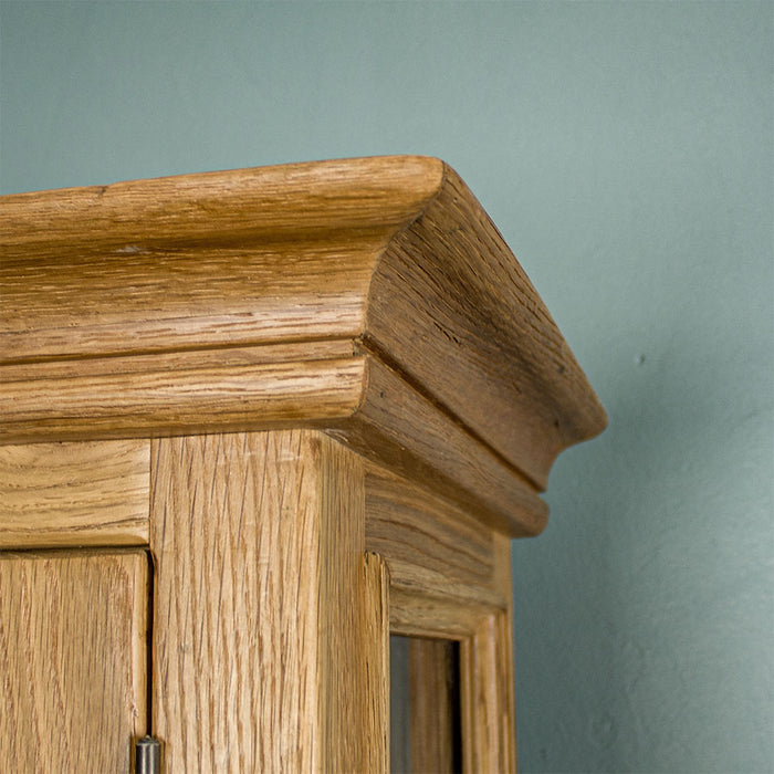 A close up of the top of the Versailles Small Display Cabinet, which shows the wood grain.