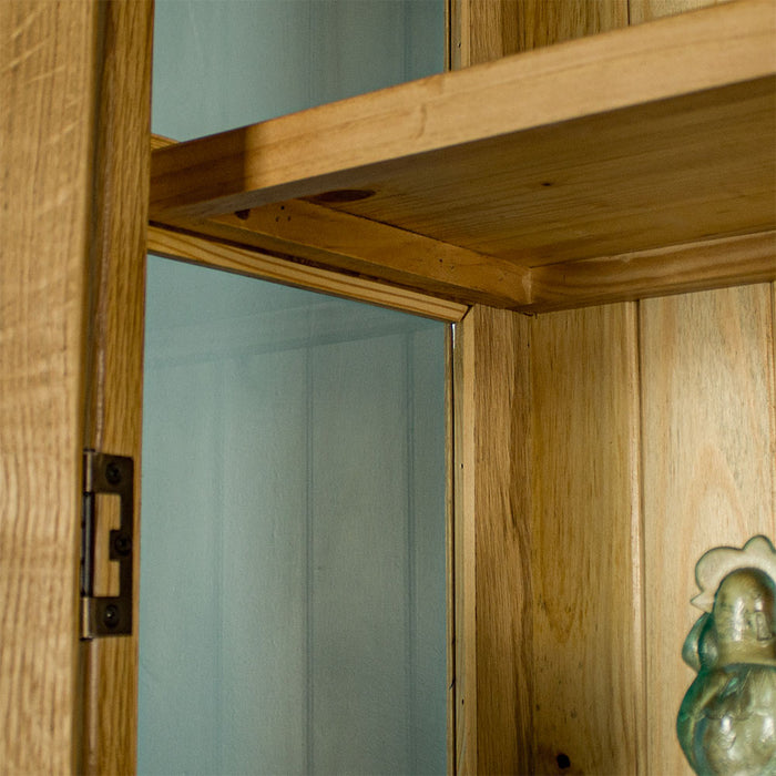 A view from under the shelf on the Vienna Oak Glass DIsplay Cabinet.