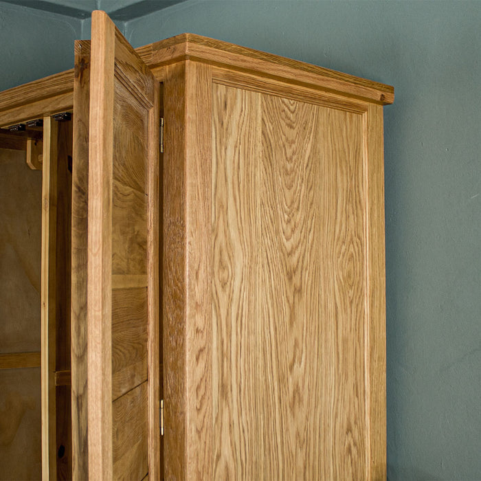 The side of the Vienna Oak Large Wardrobe, showing the wood grain and colour.